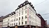 Savoy 1918 i Oslo. Hotellet utvides med naboeiendommen helt til venstre i bildet.